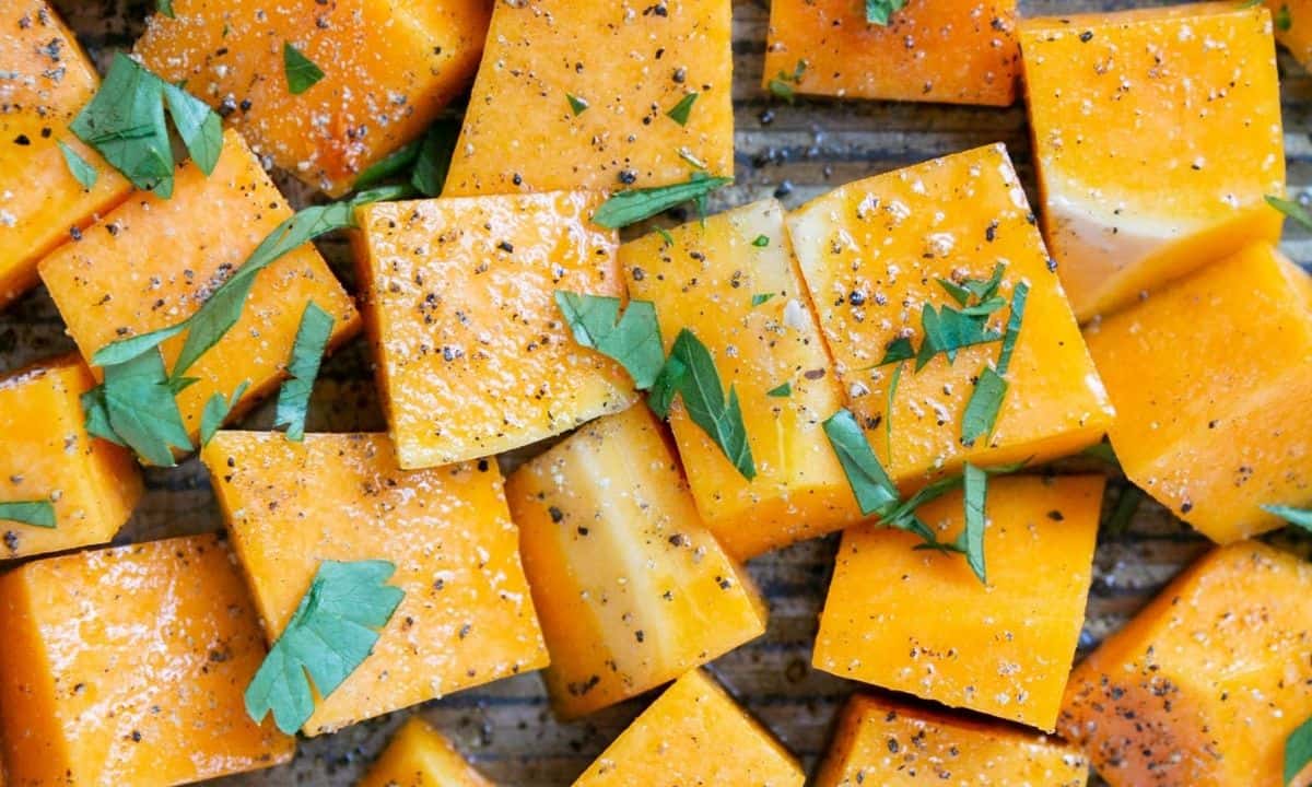 roasted butternut squash cubes on a baking sheet