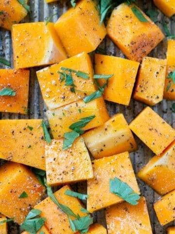 roasted butternut squash cubes on a baking sheet