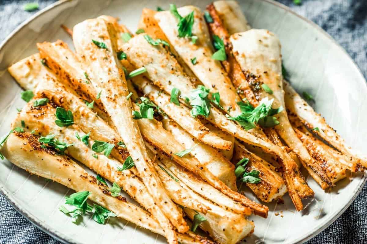 roasted parsnips in a white plate