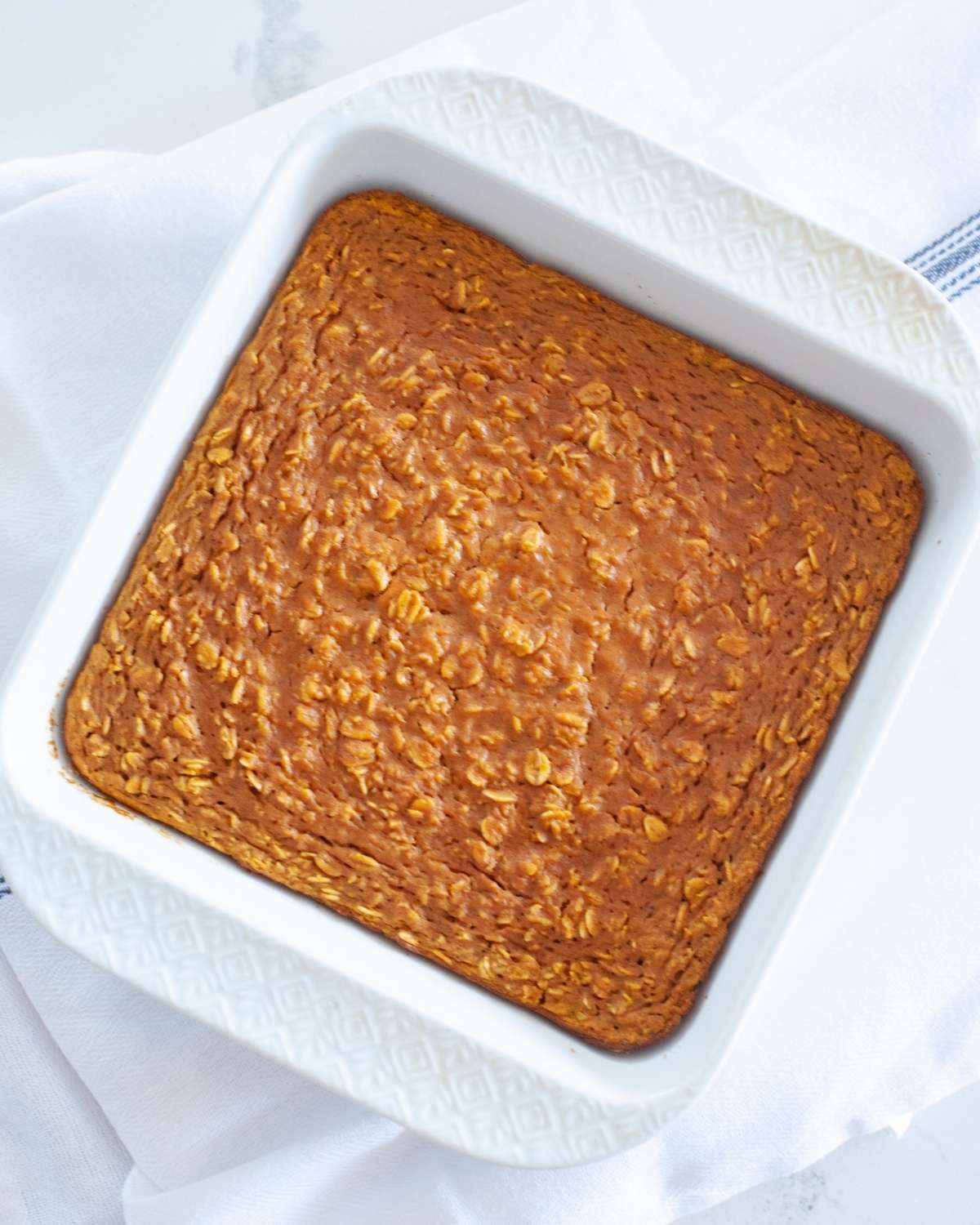 overhead view of pumpkin baked oatmeal in a square baking dish
