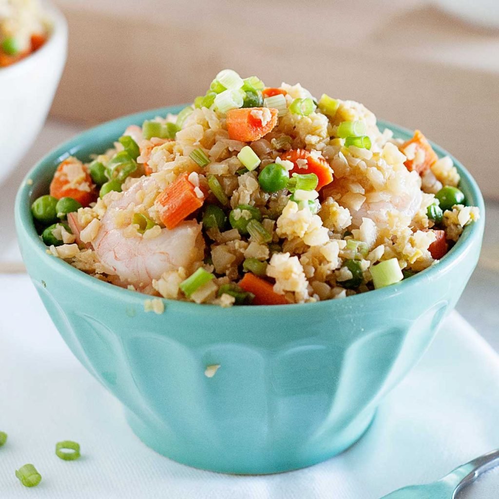 large blue bowl of shrimp cauliflower fried rice
