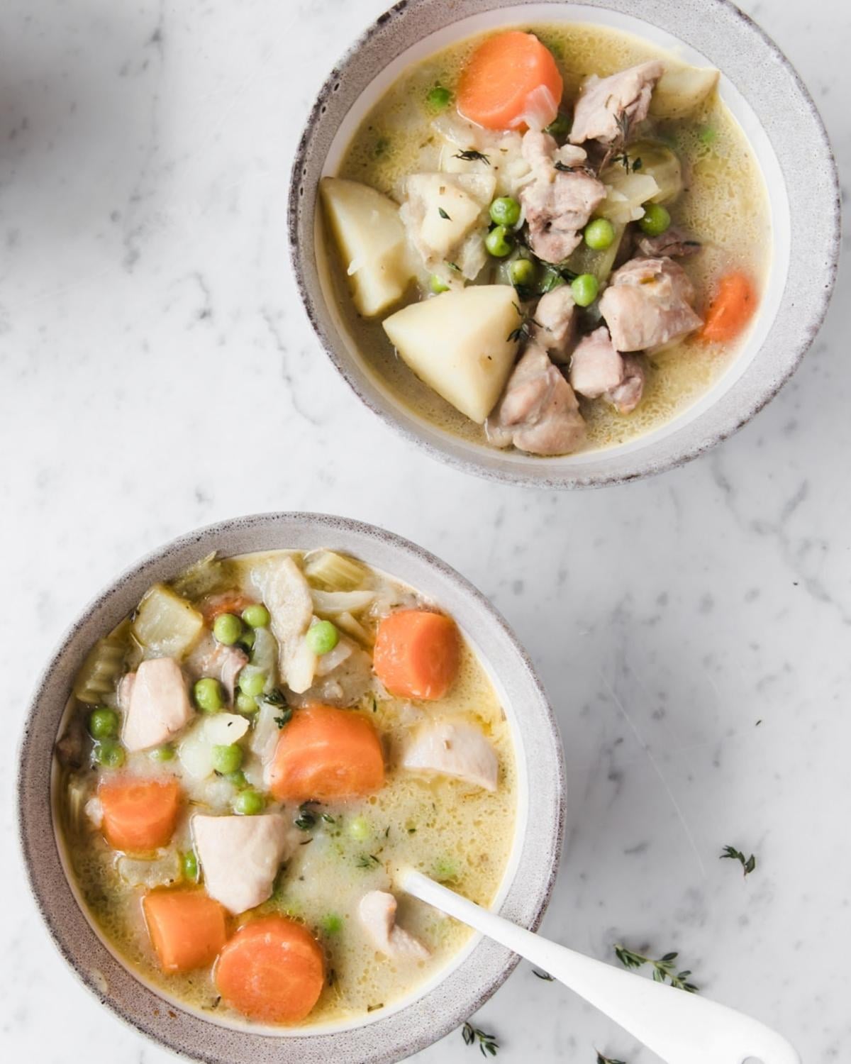 top view of two bowls of chicken stew