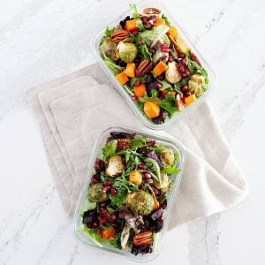 two glass lunch containers of roasted vegetable winter salad