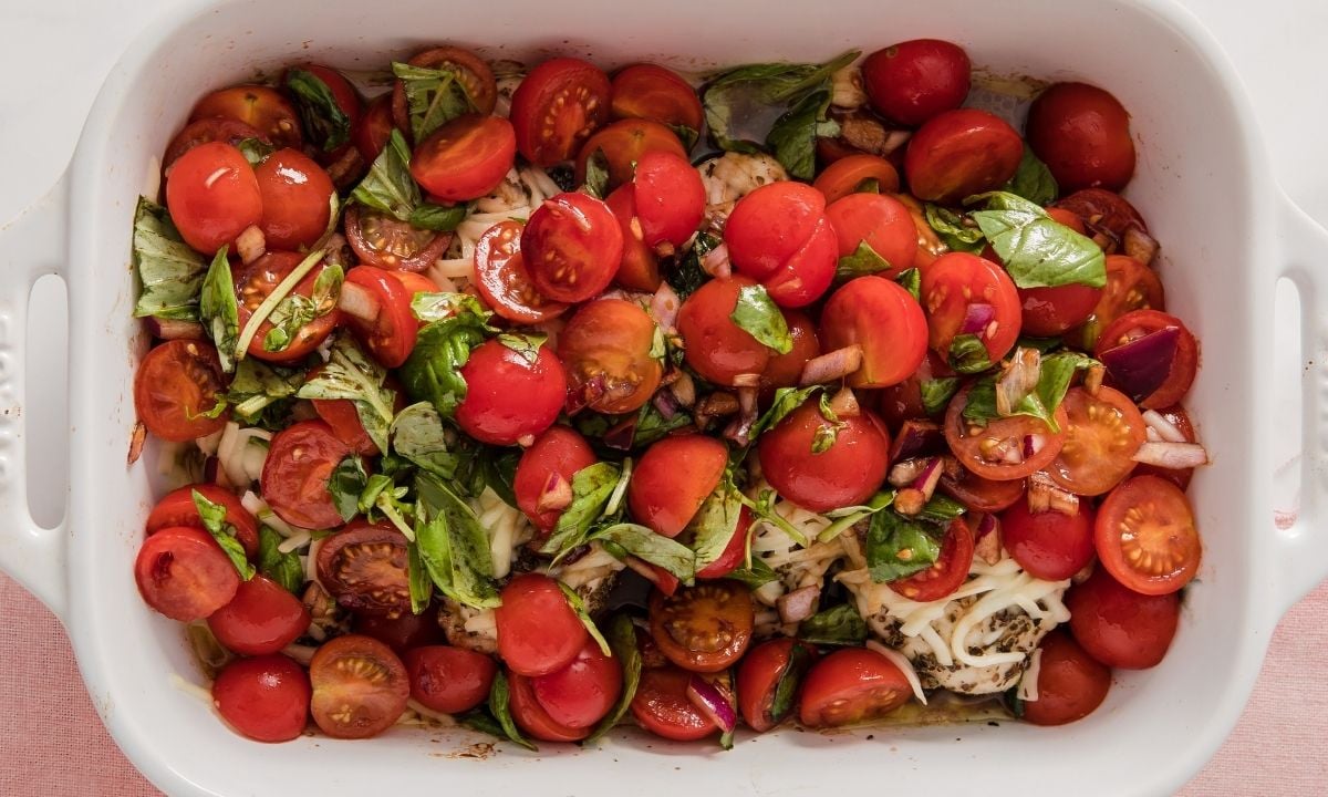 large baking dish of bruschetta chicken