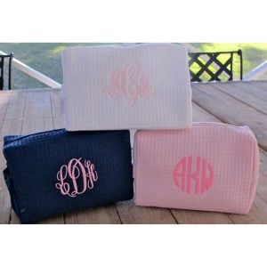 three monogrammed makeup bags