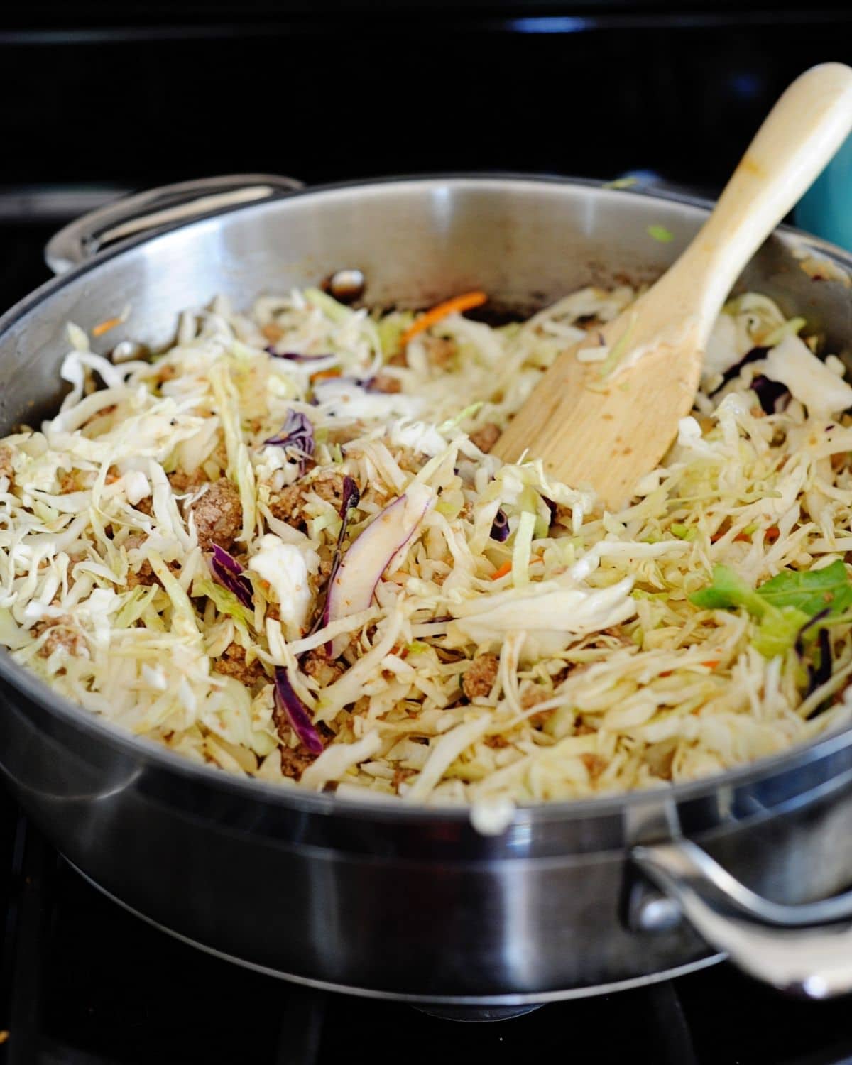 cabbage being cooked in a skillet