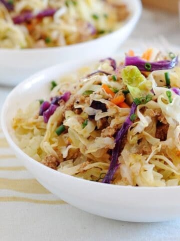 two bowls of sauteed cabbage