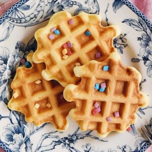 overhead view of birthday waffles with sprinkles