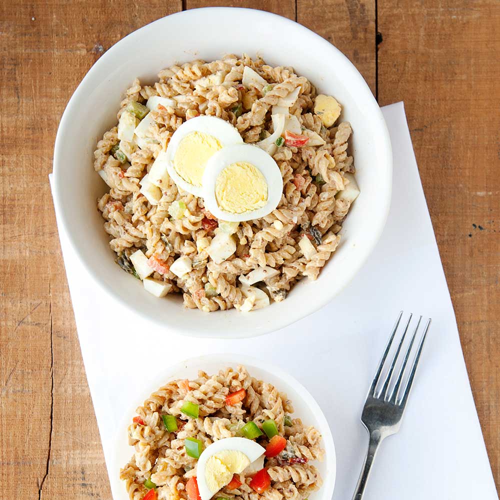 Two bowls with cajun jambalaya pasta salad