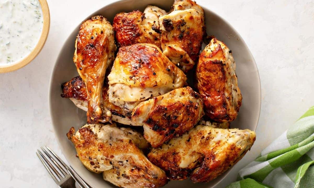 baked chicken pieces in a white plate