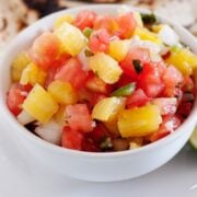 a small bowl with pineapple salsa