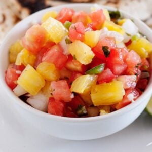 a small bowl with pineapple salsa