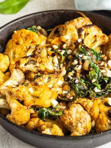 roasted curried cauliflower in a skillet