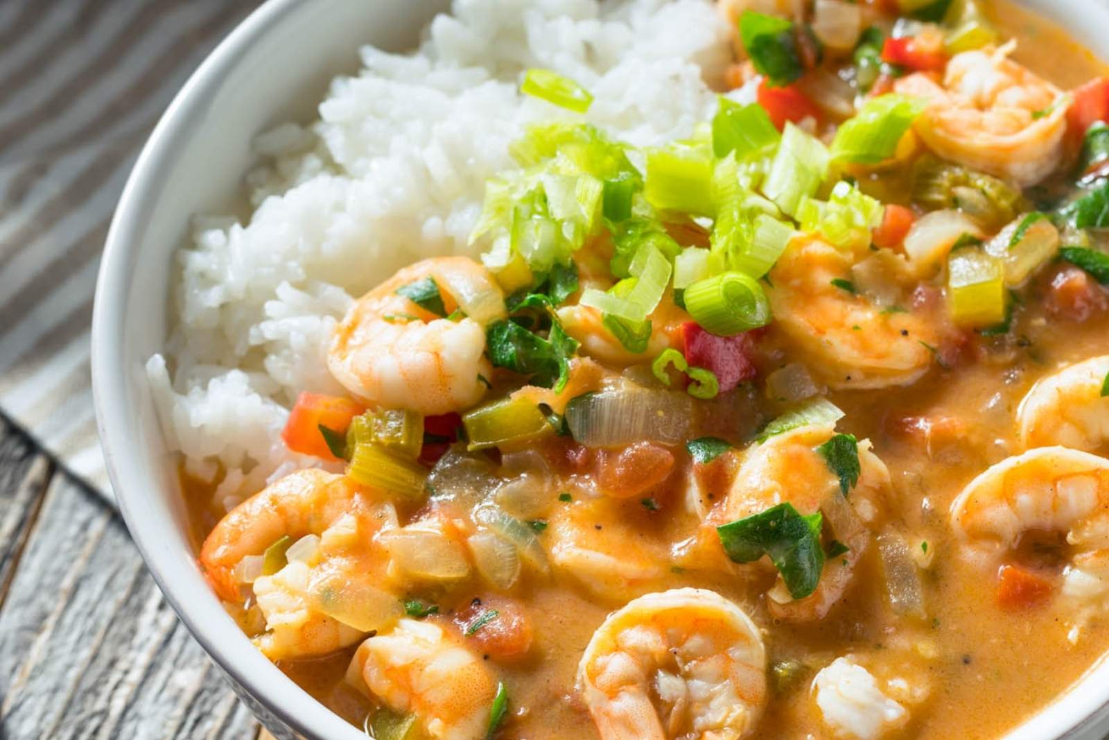 a bowl with shrimp étouffée and white rice