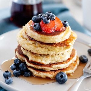 stack of paleo pancakes topped with berries