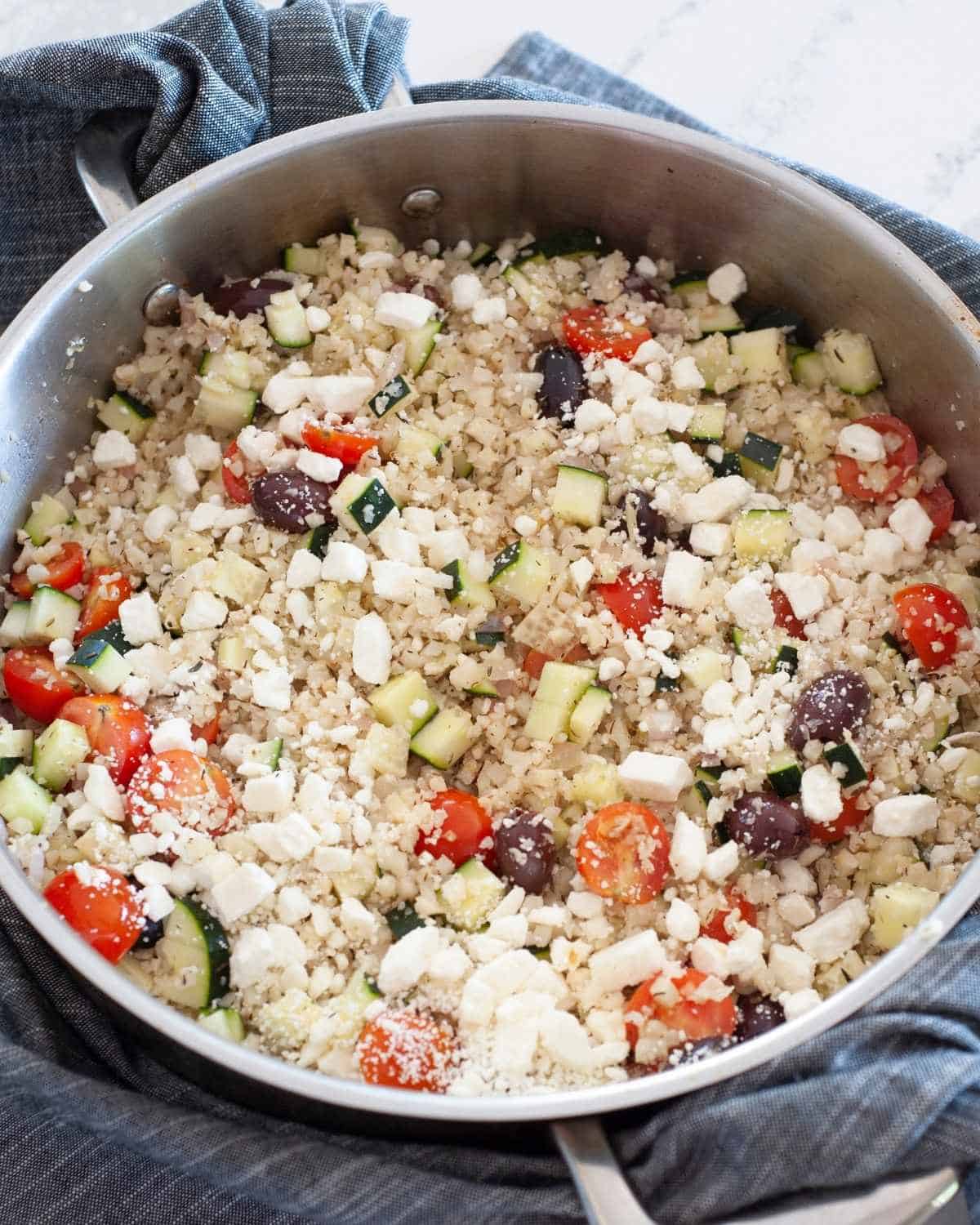 Mediterranean cauliflower rice in a skillet
