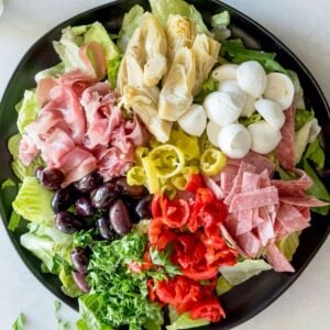 top view of antipasto salad made with charcuterie and veggies