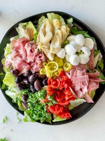 top view of antipasto salad made with charcuterie and veggies