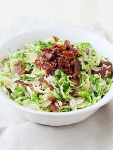 a bowl with Brussel sprout salad with bacon