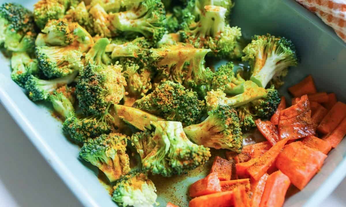 roasted broccoli and carrots in a baking dish