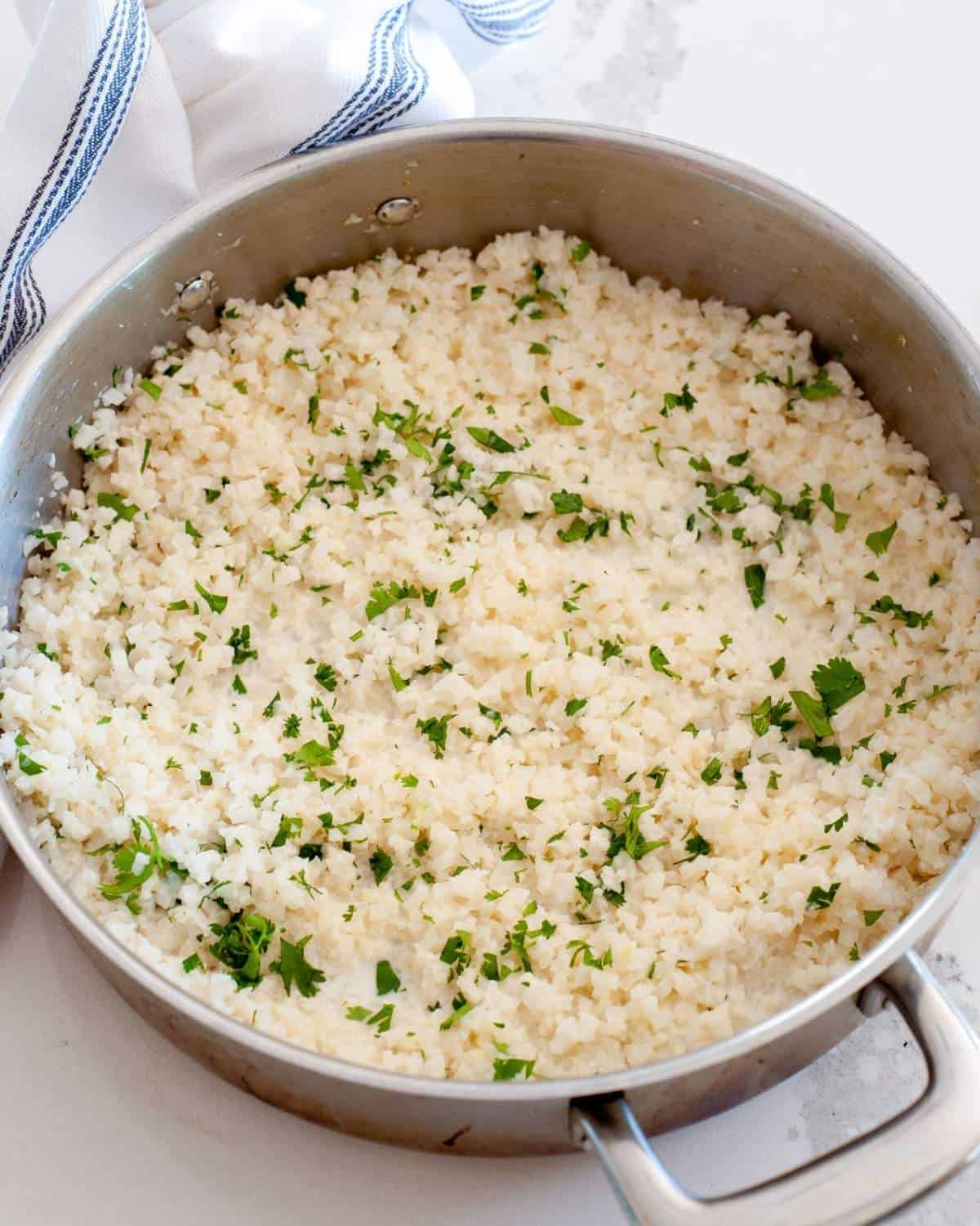 coconut cauliflower rice in a skillet