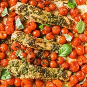 large sheet pan of roasted cherry tomatoes and salmon