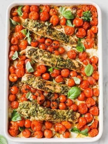 large sheet pan of roasted cherry tomatoes and salmon