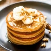 A stack of banana pumpkin pancakes on a plate