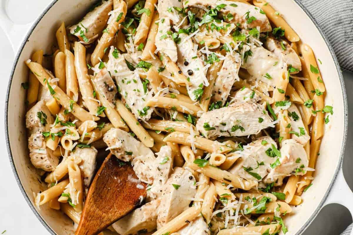 large skillet of creamy chicken pasta