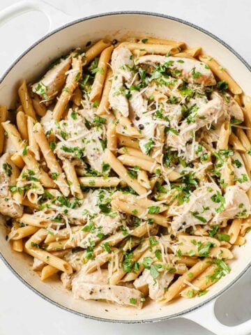 large skillet of creamy chicken pasta
