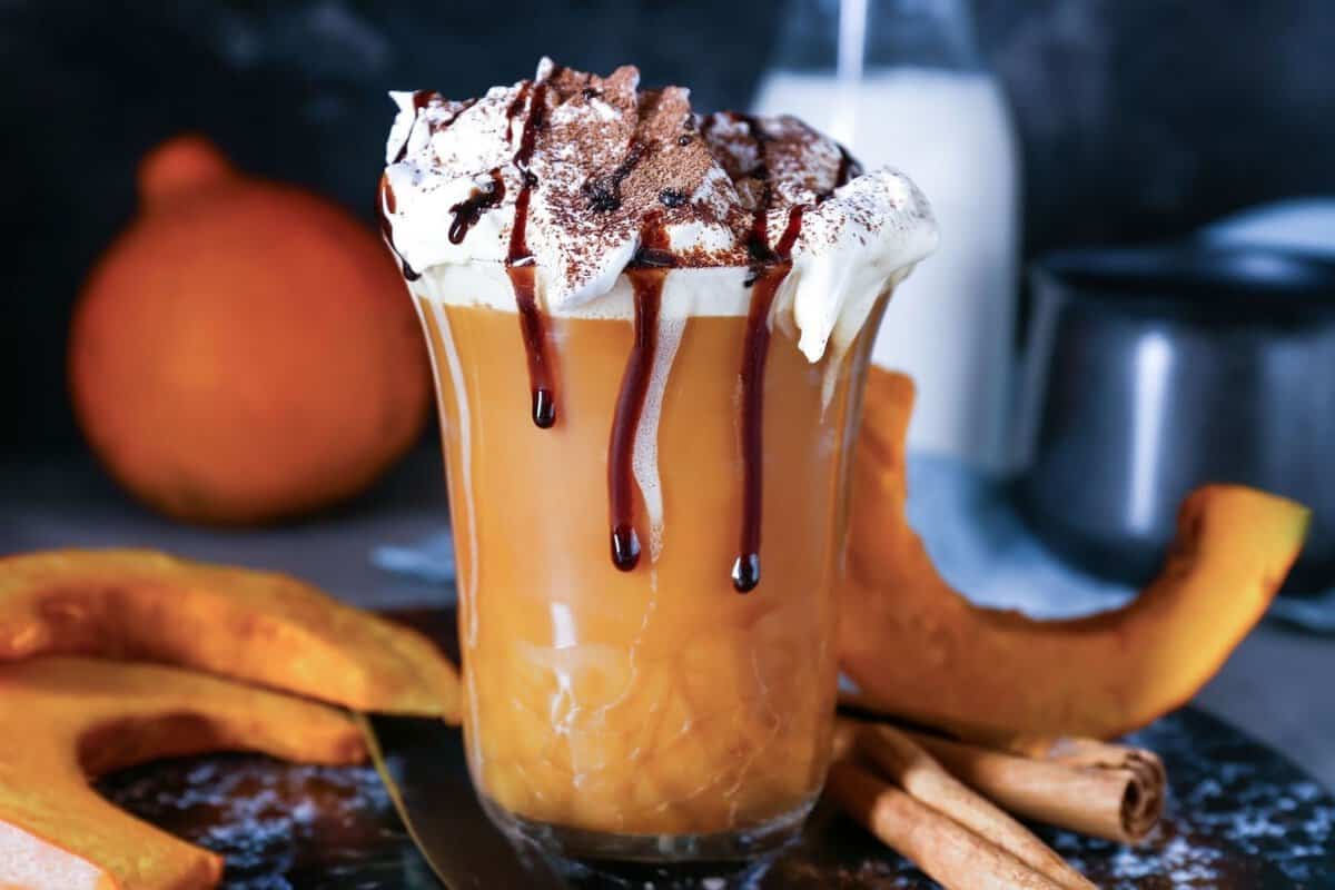 mug of pumpkin hot chocolate topped with whipped cream and chocolate
