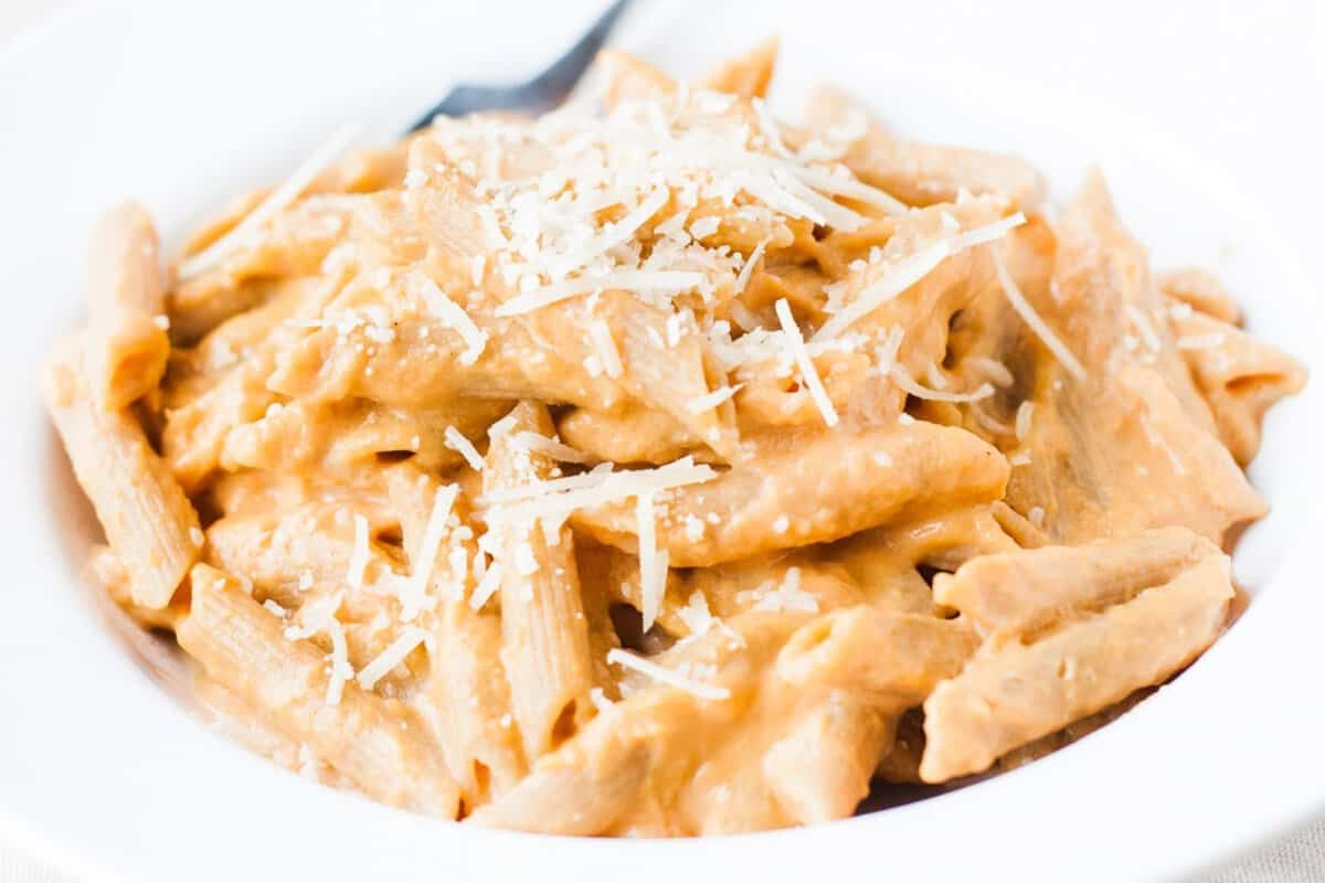 close up of penne pasta with pumpkin sauce