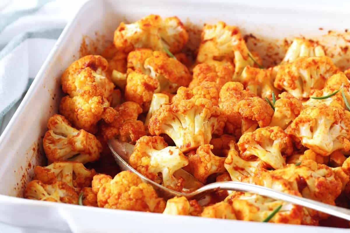 spicy roasted cauliflower florets in a while baking dish