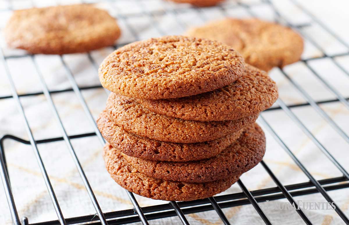 round gluten free snickerdoodle cookies on a cooling rack