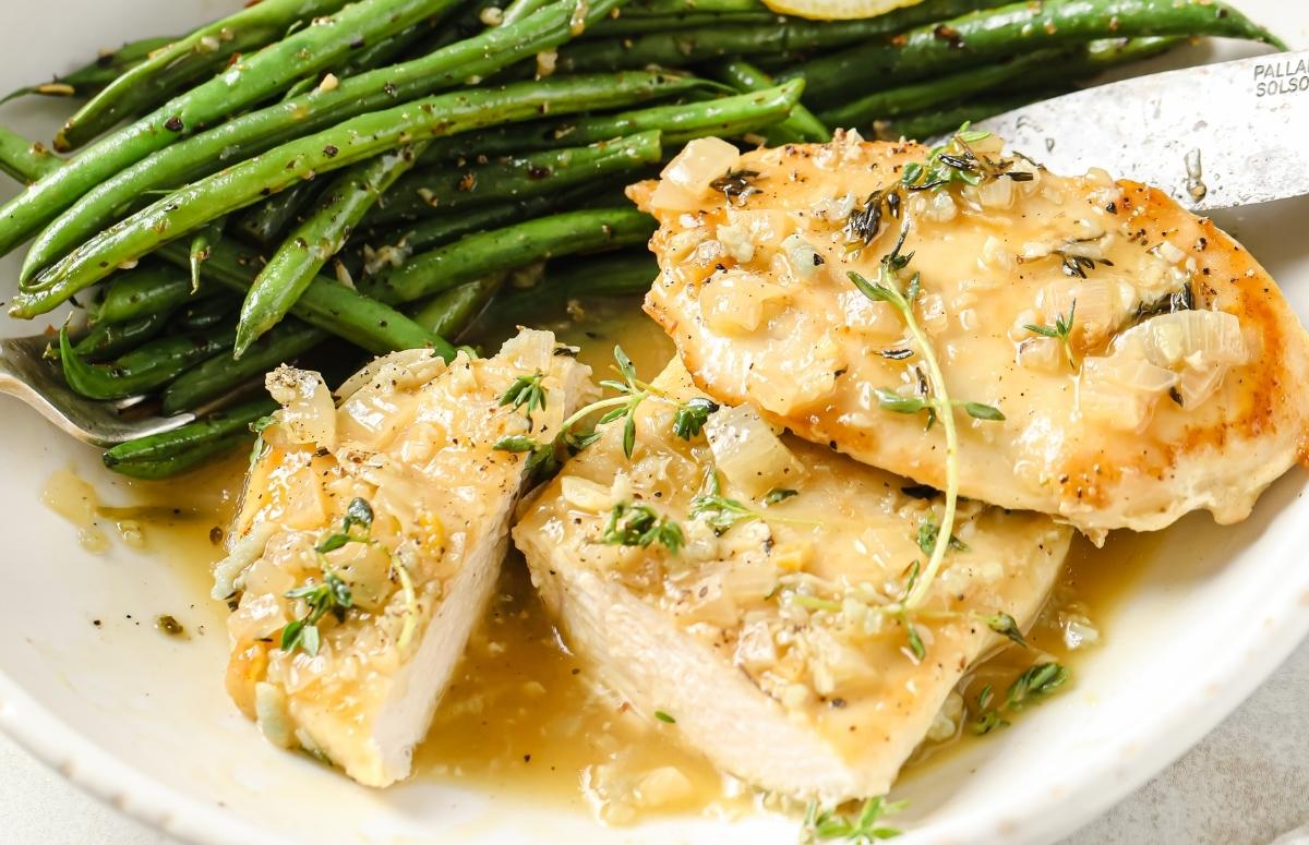 garlic chicken and green beans on a white plate