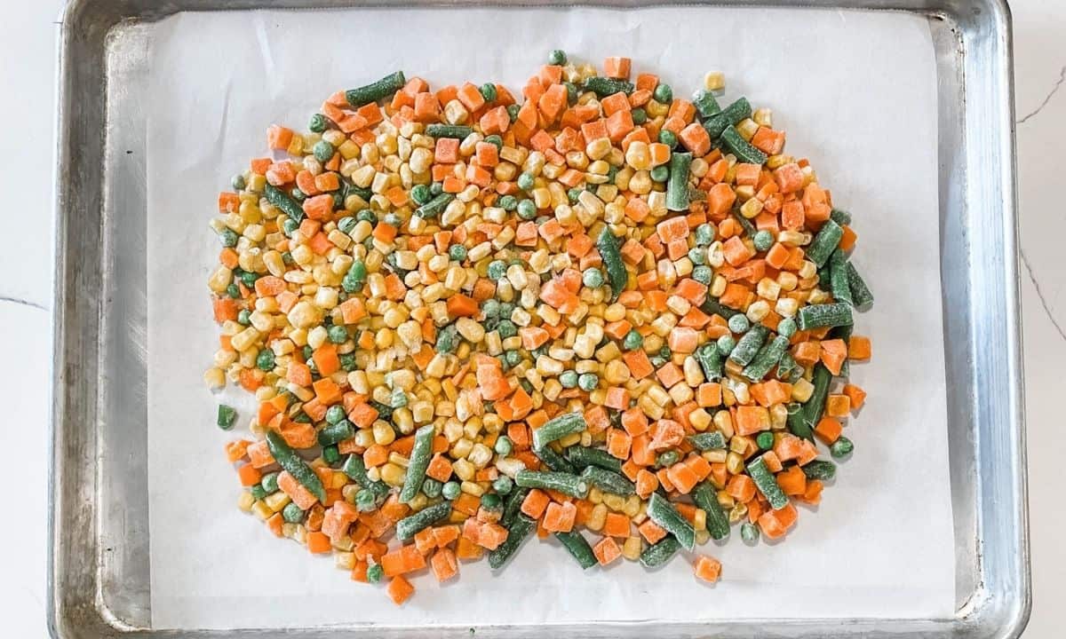 frozen vegetables in a lined baking sheet