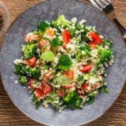 large gray plate of chopped salad with couscous