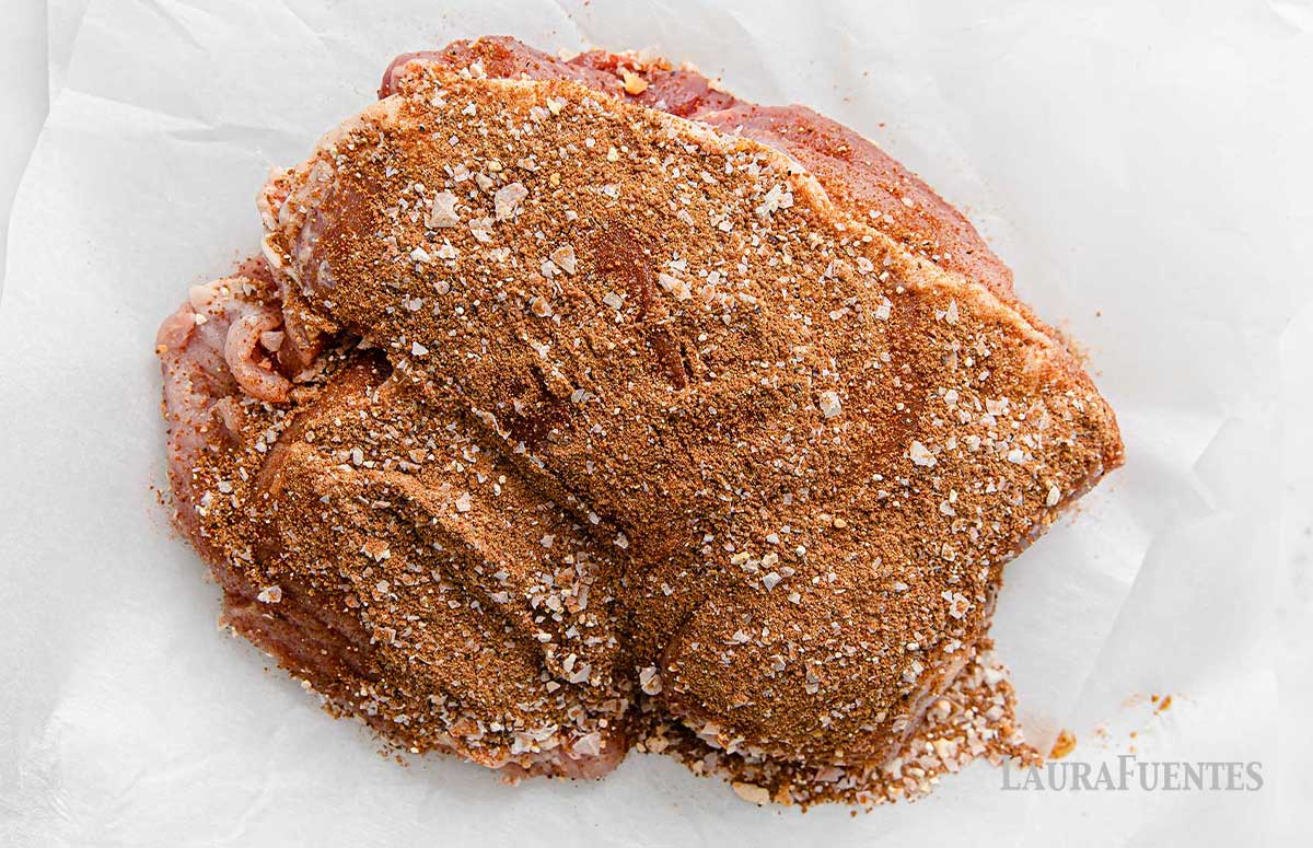 large pork roast covered in dry rub