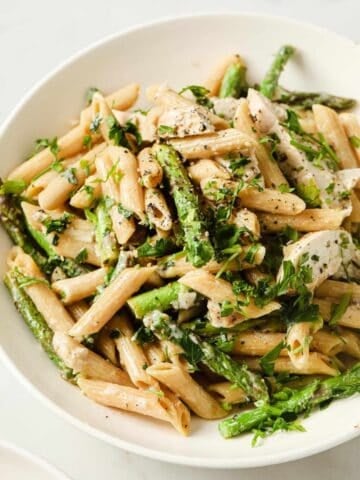 lemon chicken asparagus pasta in a white bowl