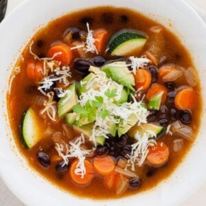 vegetable soup with black beans and zucchini in a bowl