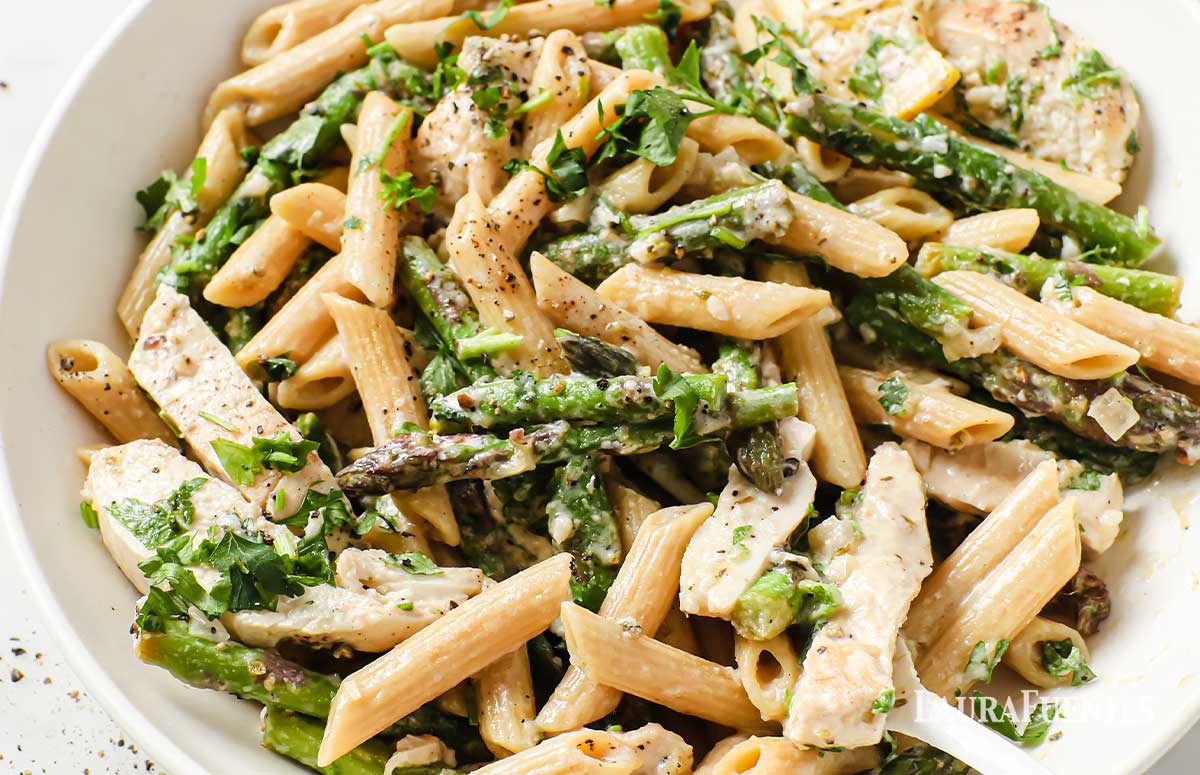 lemon garlic sauce tossed with pasta and asparagus on a plate