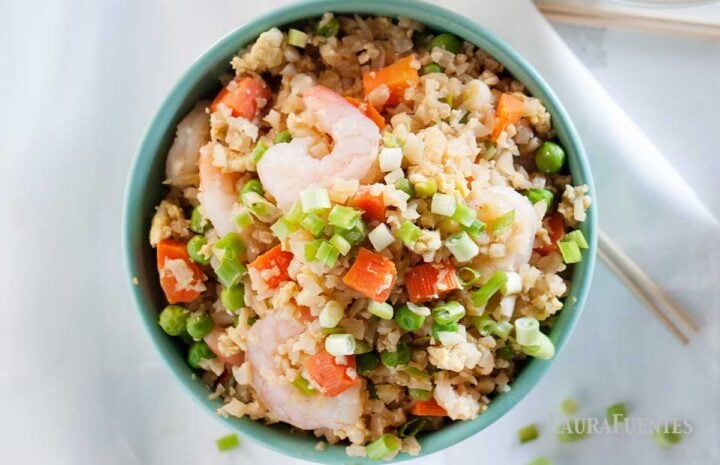 overhead view of a bowl of shrimp cauliflower fried rice