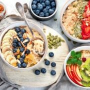 bowls of oatmeal with a variety of toppings