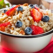 a bowl ot oatmeal topped with berries