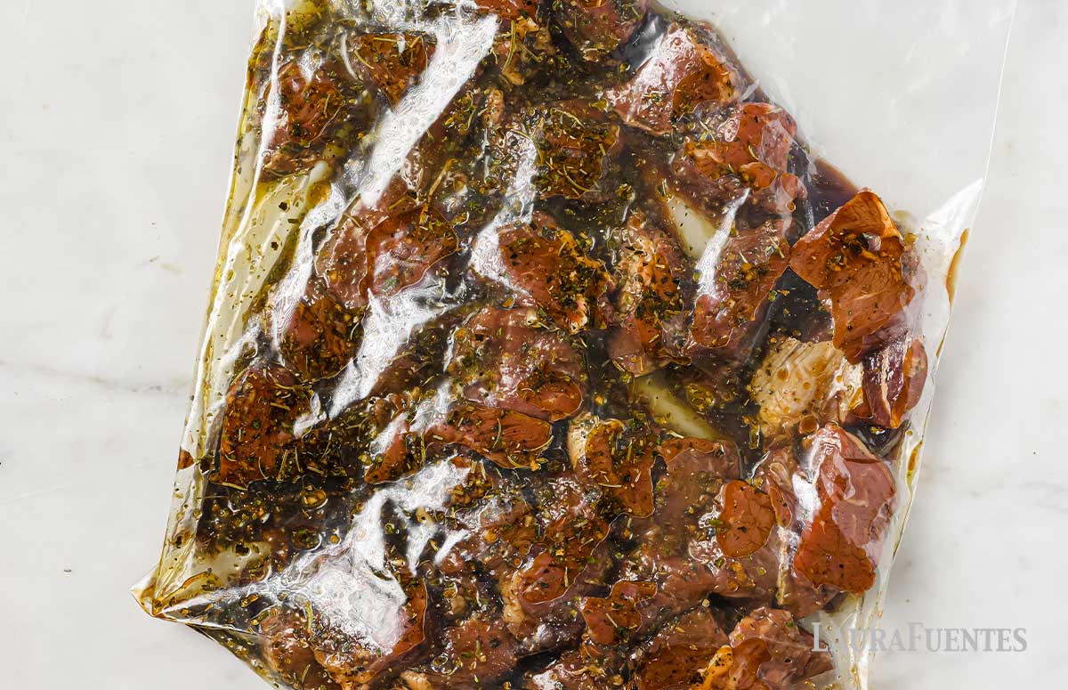 beef pieces with marinade in a zip bag
