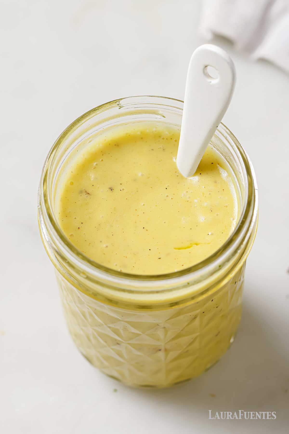 champagne vinaigrette in a glass jar.