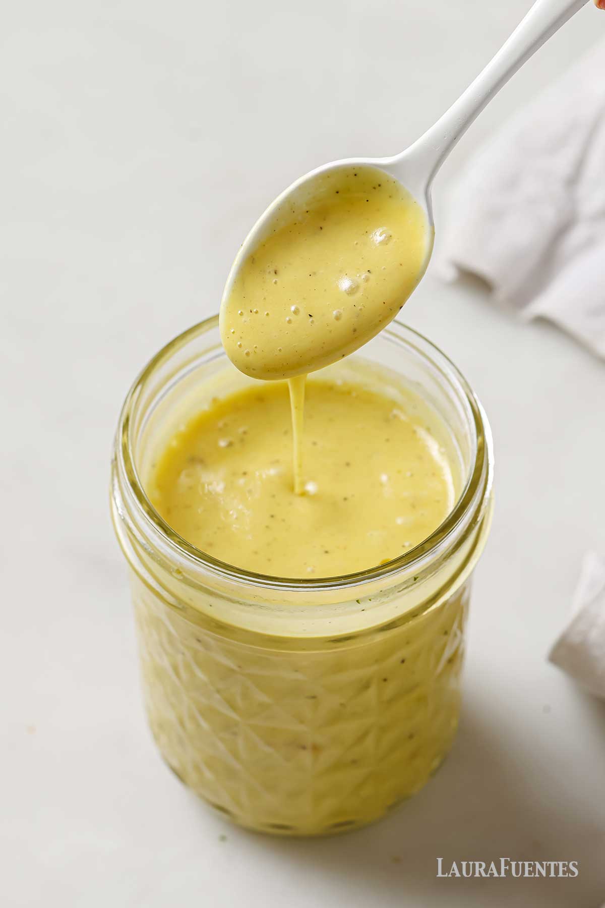 champagne vinaigrette in a glass jar.