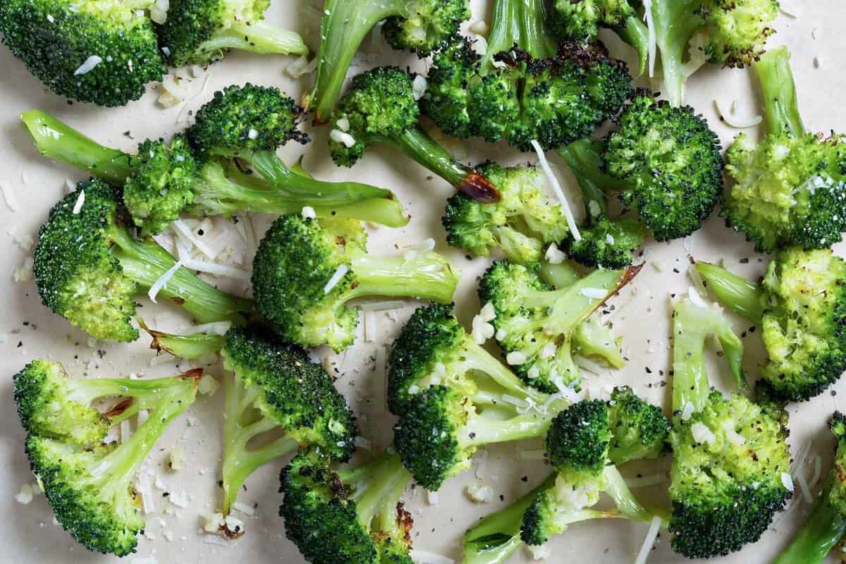 roasted Parmesan broccoli florets in a lined baking sheet