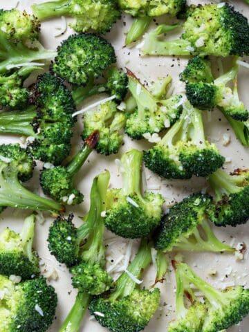 roasted Parmesan broccoli florets in a lined baking sheet