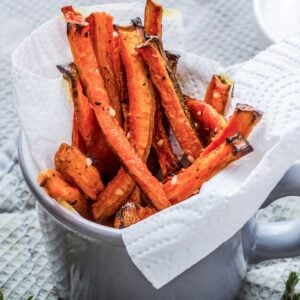baked carrot fries in a serving bowl